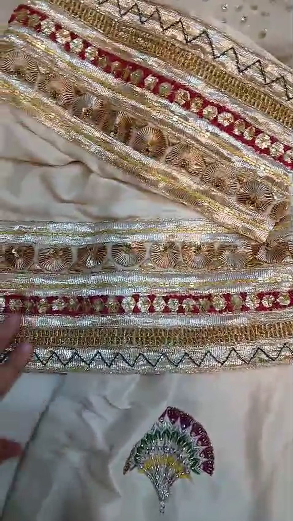 Hand-embroidered gota and zari borders on an ivory outfit, made in our workshop
