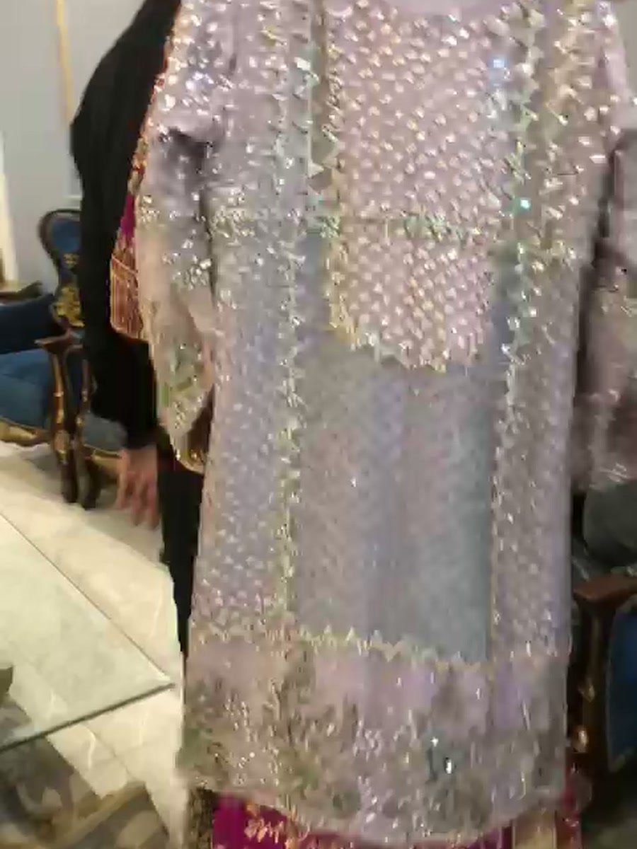 The lilac crystal shirt shown over a magenta outfit